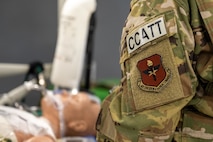 U.S. Air Force Air Education and Training Command and Critical Care Air Transport Team (CCATT) patches are displayed during the “Vapor Trails” exercise at Kelly Airfield, San Antonio, Texas, Aug. 21, 2025. CCATT is a three-person medical team, usually consisting of a physician, a critical care nurse, and a respiratory therapist. (U.S. Air Force photo by Airman 1st Class Lauren Torres)