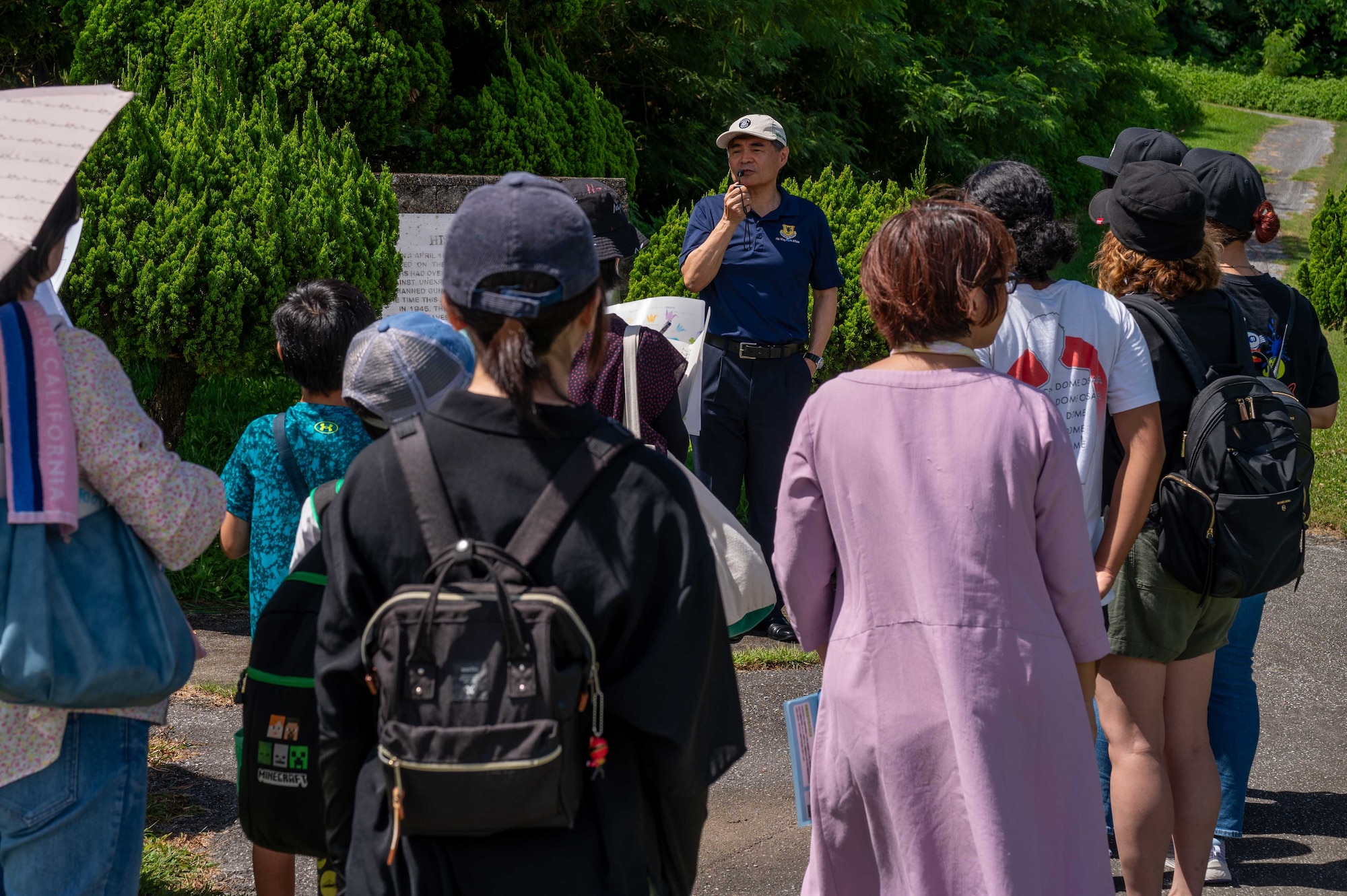 Hideaki Sakihama, 18th Wing Public Affairs community engagement specialist, explains the importance of the former hospital cave on Kadena Air Base, Japan, Aug. 13, 2025.