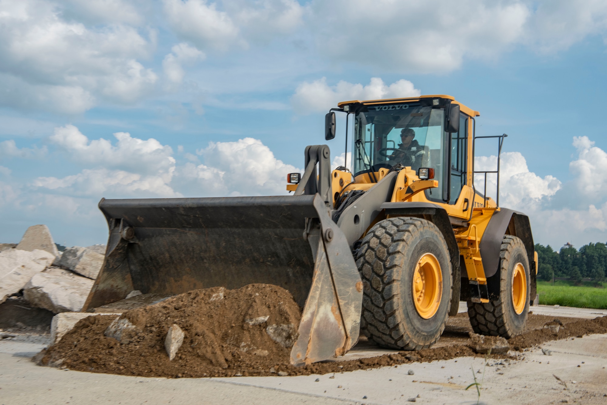 A U.S. Air Force Airman assigned to the 51st Civil Engineer Squadron clears debris excavated from the runway while conducting rapid airfield damage repair during exercise Ulchi Freedom Shield 25 at Osan Air Base, Republic of Korea, Aug. 20, 2025