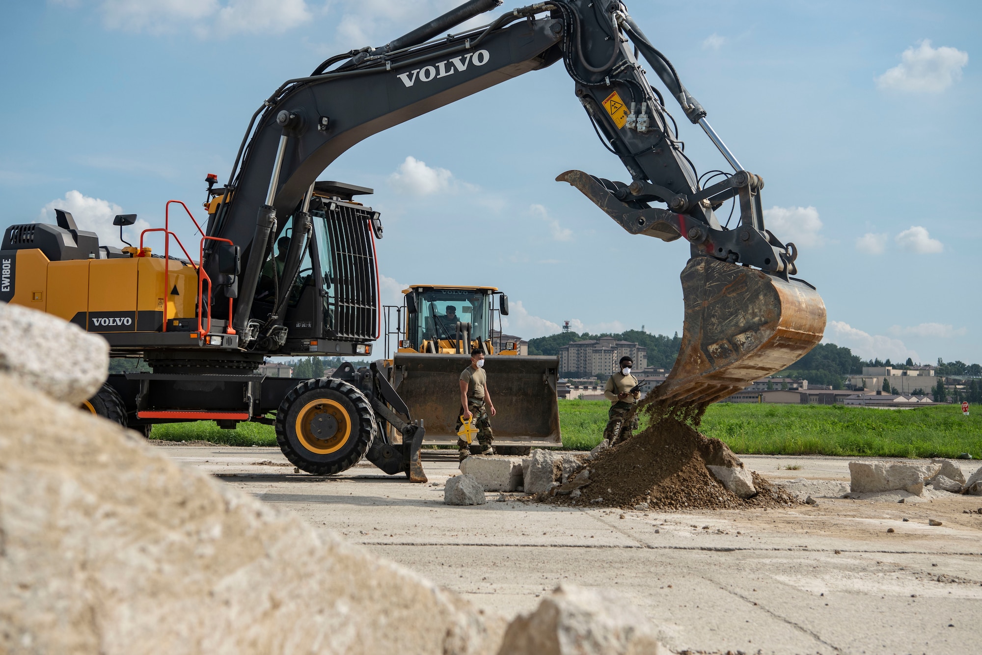 A U.S. Air Force Airman assigned to the 51st Civil Engineer Squadron uses an excavator to remove unusable concrete while conducting rapid airfield damage repair during exercise Ulchi Freedom Shield 25 at Osan Air Base, Republic of Korea, Aug. 20, 2025