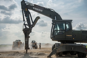 A U.S. Air Force Airman assigned to the 51st Civil Engineer Squadron uses a vehicle mounted jackhammer to break up portions of unusable concrete to conduct rapid airfield damage repair during exercise Ulchi Freedom Shield 25 at Osan Air Base, Republic of Korea, Aug. 20, 2025