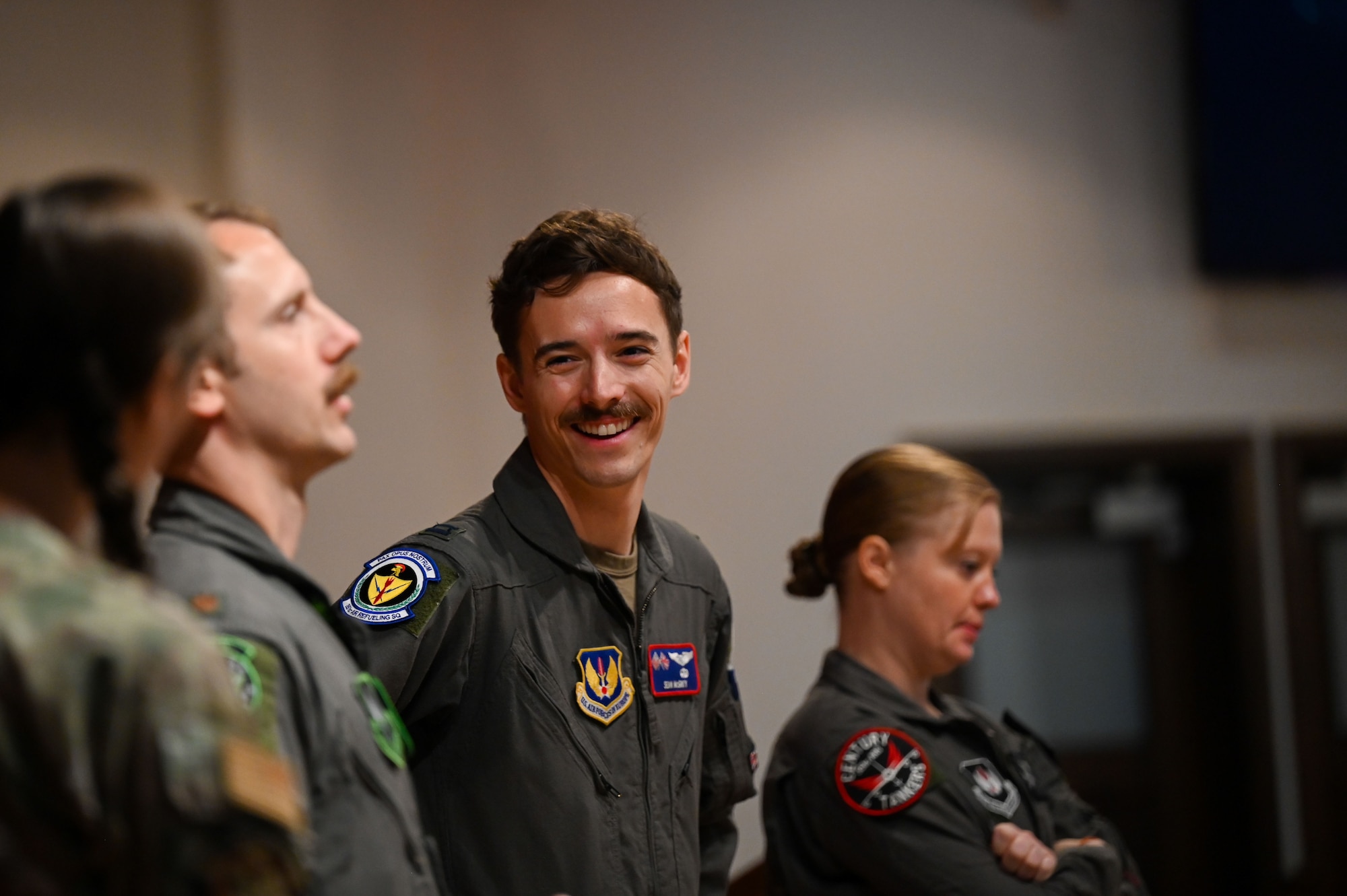 U.S. Air Force Capt. Sean McGinty, 351st Air Refueling Squadron KC-135 Stratotanker pilot, smiles during a Q&A panel held for the 2025 Retiree Appreciation Day at RAF Mildenhall, England, Aug. 15, 2025.