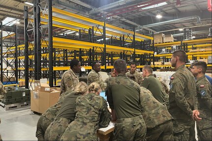 A team of U.S. Army automated logistics specialists from the Combat Aviation Brigade, 1st Armored Division, train Polish service members from the 33rd Army Prepositioned Stocks Battalion at the Powidz Army Prepositioned Stocks-2 worksite in Poland on Supply and Support Activity operations and Global Combat Support System-Army. (U.S. Army courtesy photo)