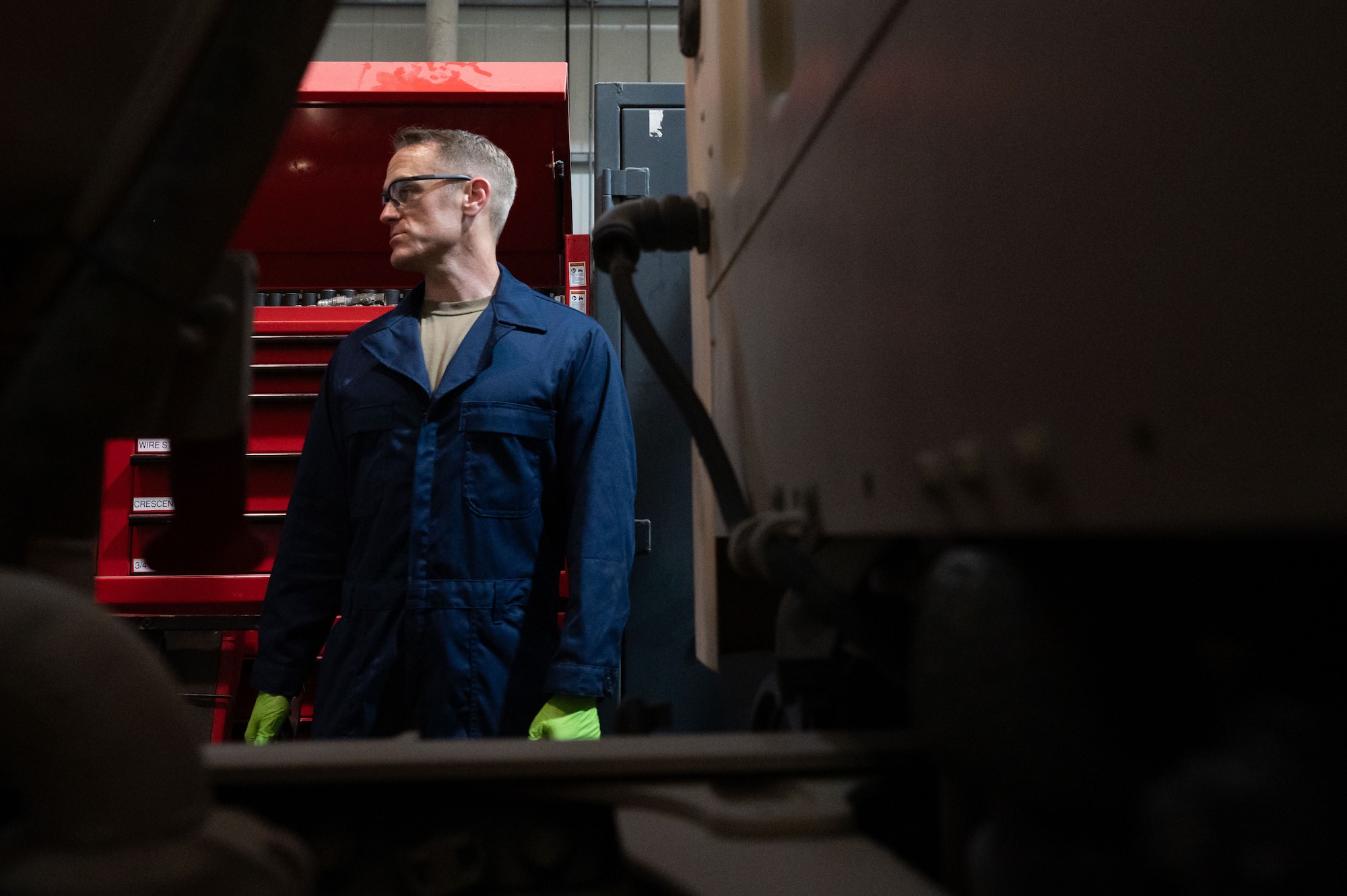 U.S. Air Force Col. Scott C. Johnson, 379th Air Expeditionary Wing deputy commander, prepares to conduct a maintenance inspection within the U.S. Central Command area of responsibility, Aug. 21, 2025. The 379th Expeditionary Logistics Readiness Squadron vehicle maintenance shop keeps fire trucks, fuel tankers, and heavy equipment mission-ready through routine maintenance, repairs and inspections. (U.S. Air Force photo by Senior Airman Dieondiere Jefferies)