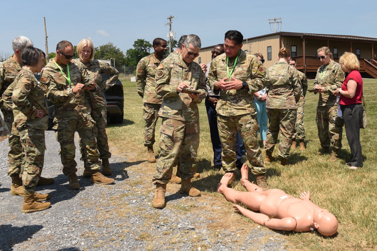 Image of Airmen observing and talking together.
