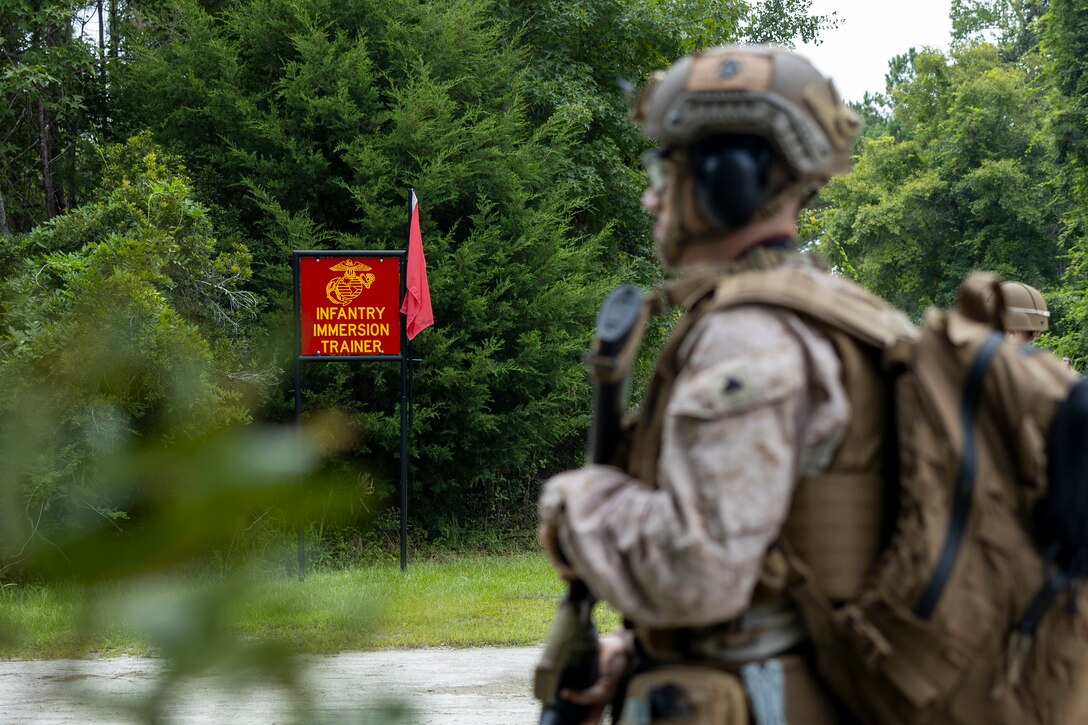 U.S. Marine Corps Cpl. Aydan Millette, a combat graphics specialist with II Marine Expeditionary Force Support Battalion, participates in the Outdoor Infantry Immersion Trainer at Camp Lejeune, North Carolina, Aug. 19, 2025. Marines from the Communication Strategy and Operations Company, II MSB, took part in the O-IIT to gain realistic training and demonstrate their capabilities to effectively communicate commander’s themes and messages in a combat environment. (U.S. Marine Corps photo by Sgt. Jacquilyn Davis)
