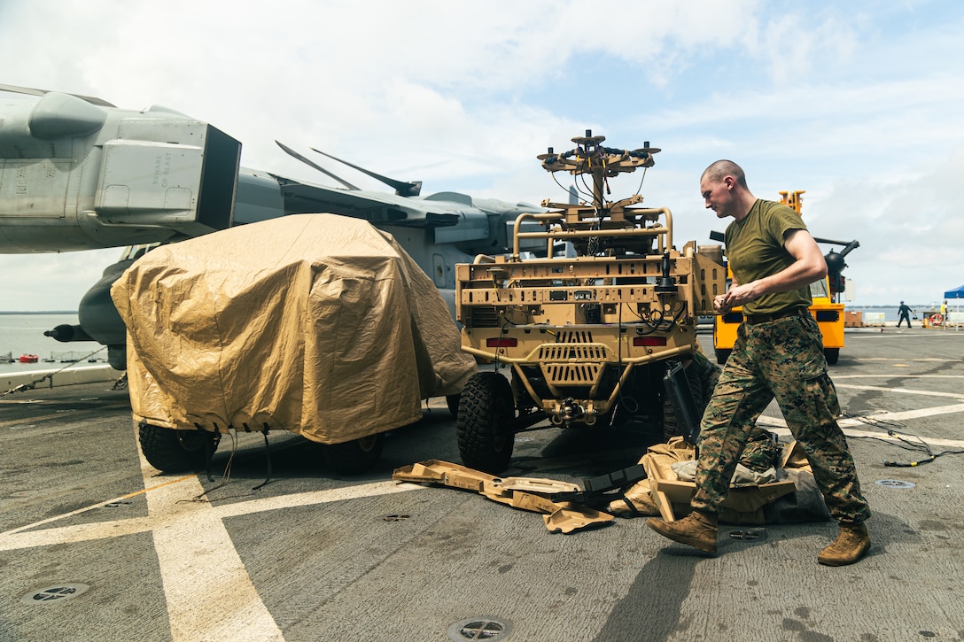 U.S. Marine Corps Cpl. Calix Wheaton, an air-defense systems technician with Marine Medium Tiltrotor Squadron 263 (Reinforced), 22nd Marine Expeditionary Unit (Special Operations Capable), conducts maintenance on the Light Marine Air-Defense Integrated System, while aboard the San Antonio-class amphibious transport dock ship USS San Antonio (LPD 17), Iwo Jima Amphibious Ready Group, at Naval Air Station Norfolk, Virginia, Aug. 20, 2025. The Marines assigned to the low-altitude air defense platoon performed the maintenance in preparation for the 22nd MEU(SOC)’s regularly scheduled deployment. (U.S. Marine Corps photo by Cpl. Maurion Moore)