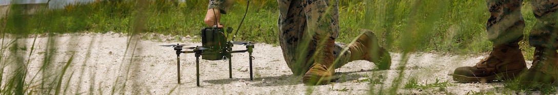 U.S. Marine Corps Cpl. Hunter Zenoni, a precision weapons technician and group one small Unmanned Aerial System operator, conducts preflight checks during a sUAS joint interoperability training exercise at an undisclosed location within the U.S. Northern Command area of responsibility