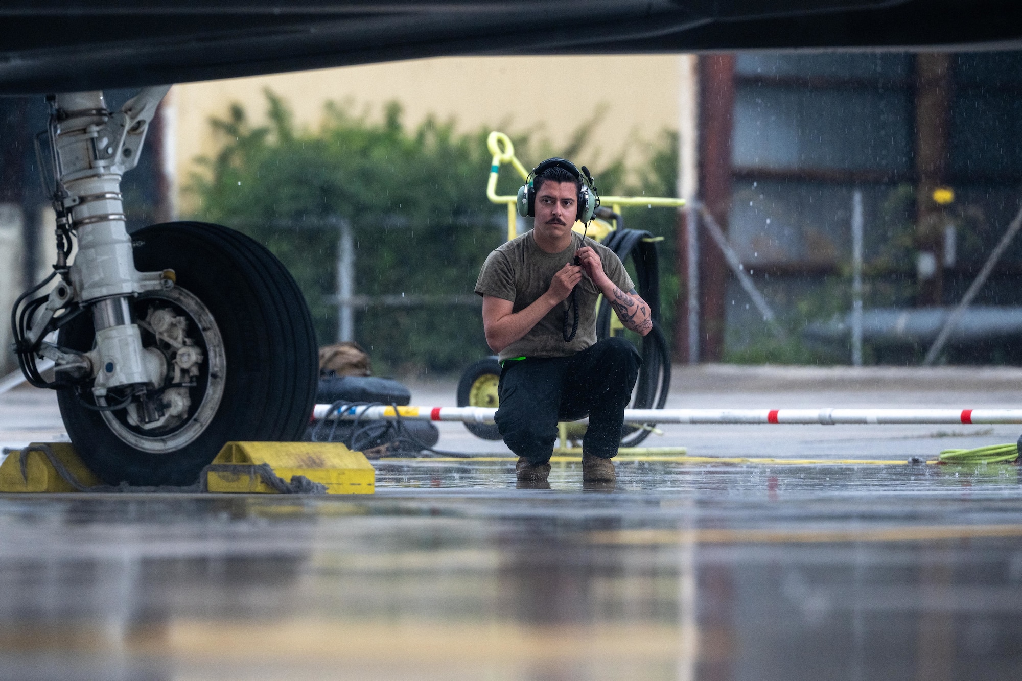 Airman performing pre-flight inspections