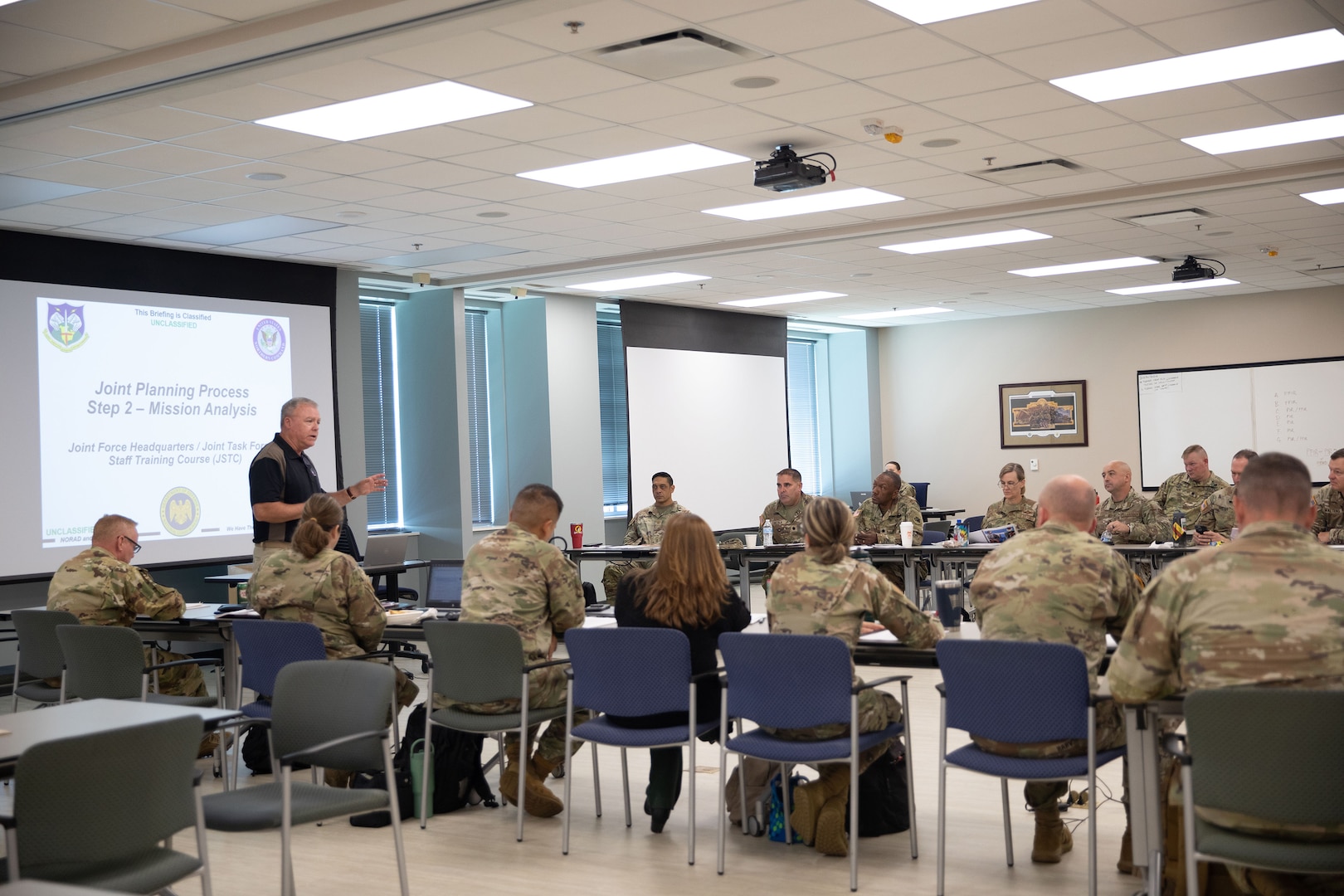 A mobile training team instructor from North American Aerospace Defense Command (NORAD) and U.S. Northern Command (USNORTHCOM) prepares joint staff planners from the Georgia National Guard for a classroom exercise during a Joint Forces Headquarters/Joint Task Force Staff Training Course (JSTC) at the Clay National Guard Center in Marietta, Ga., August 19, 2025.
