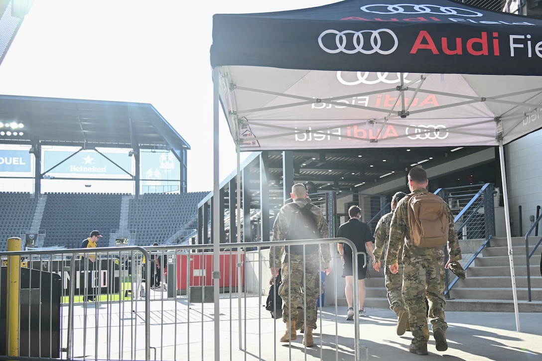 U.S. Airmen assigned to the 1st Helicopter Squadron arrive at Audi Field in Washington, D.C., Aug. 23, 2025. The Airmen coordinated a flyover of three UH-1N helicopters ahead of the D.C. United vs. Inter Miami soccer game.