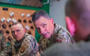 U.S. Air Force Maj. Gen. Trent Davis (right), Department of the Air Force chief of chaplains, speaks with Airmen during a squadron visit, Aug. 22, 2025, at Luke Air Force Base, Arizona.