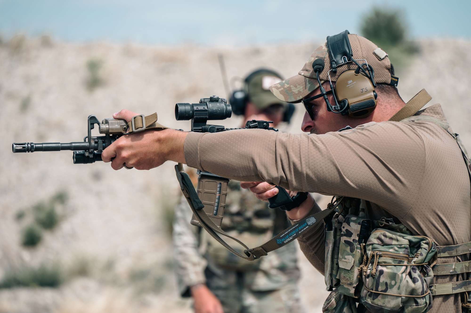 An Airman reloads his weapon.