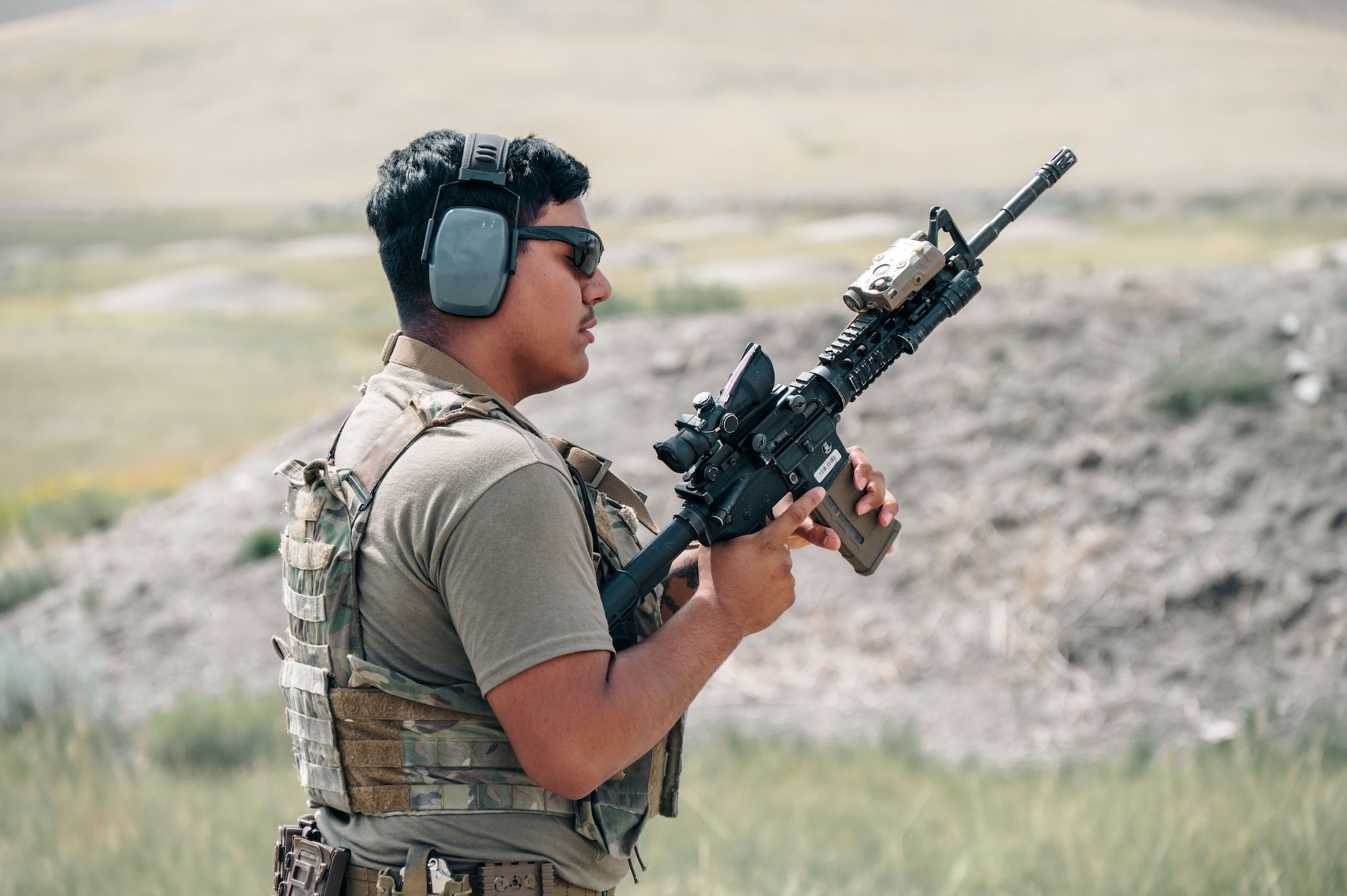 An Airman reloads his weapon.