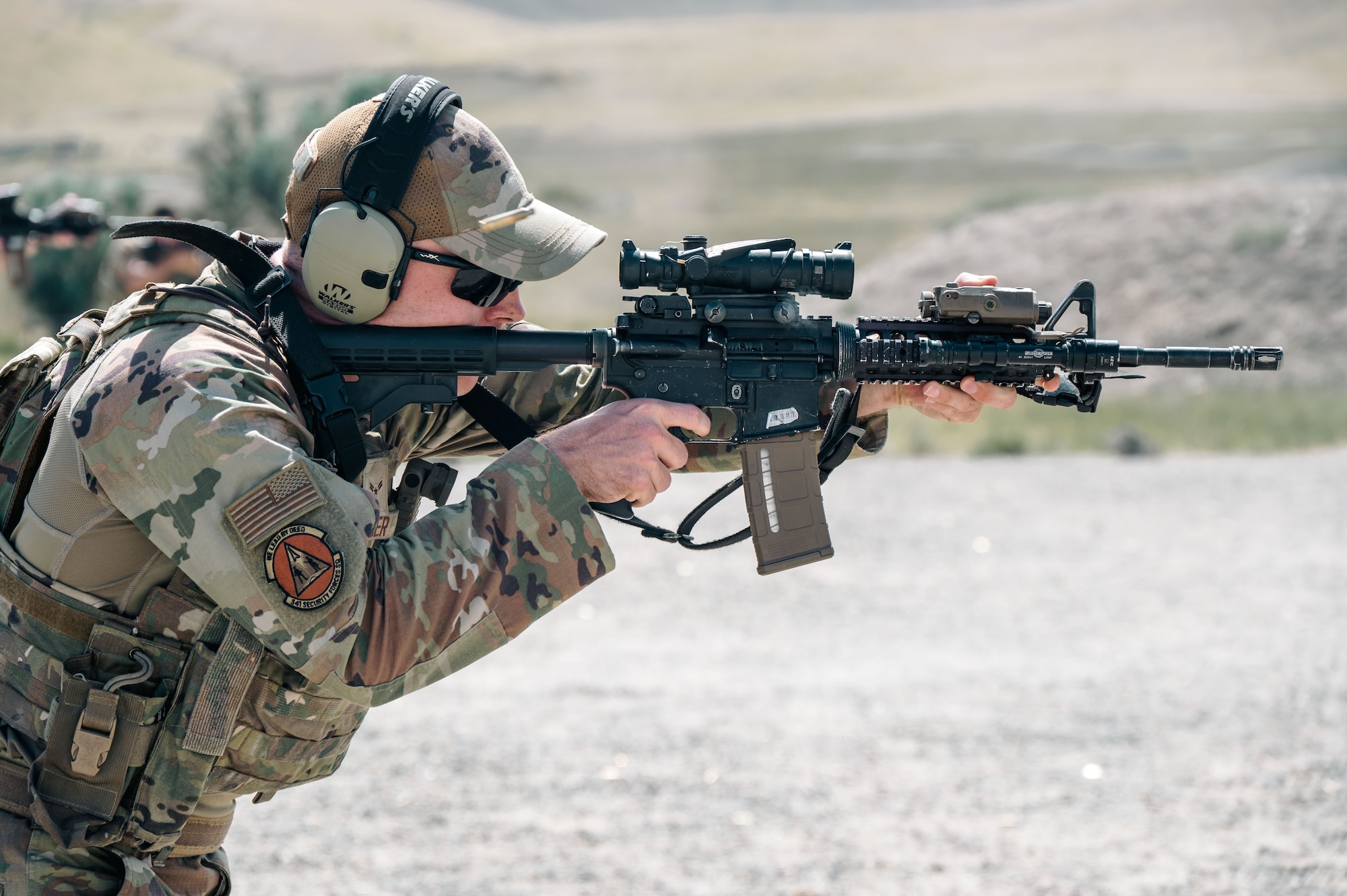 An Airman shoots at a target.