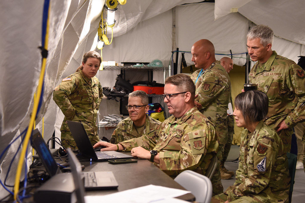 Air Force senior medical leaders preview a demonstration of the Operational Medicine Care Delivery Platform during a site visit hosted by the Air Force Medical Command’s A5T, the operational test division under the Capability Development Directorate, at a testing location, Fort Detrick, Maryland, July 24, 2025. Attended by Air Force and Space Force Surgeon General Lt. Gen. John J. DeGoes, AFMEDCOM Chief of Staff Brig. Gen. Eveline Yao, and Director of Policy and Resources Brig. Gen. Jason Lennen, the site visit exhibited technological capabilities for battlefield care. (U.S. Air Force photo by Megan Hearst)