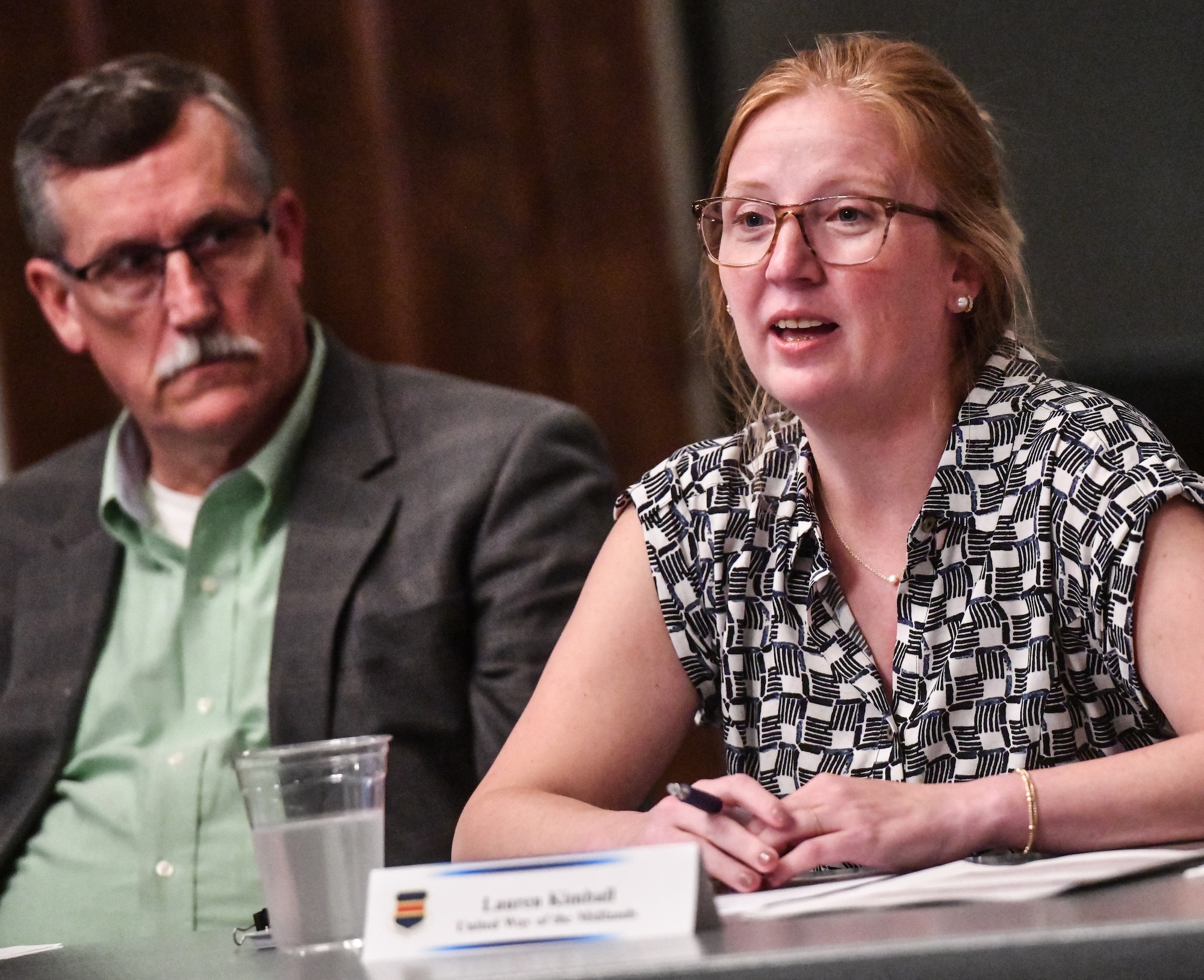 Lauren Kimball, United Way of the Midlands chief strategy officer, speaks about the 211 Helpline initiative at the Offutt Event Center on August 12, 2025. The Offutt Air Force Base Community Partnership Program is a quarterly meeting with base leadership and the surrounding communities.