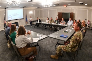 Krista Hoffart, 55th Civil Engineer Squadron chief of plans and programs, briefs civic and community leaders at the Offutt Event Center on August 12, 2025. The Offutt Air Force Base Community Partnership Program is a quarterly meeting with base leadership and the surrounding communities.