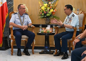 Two men sitting talking