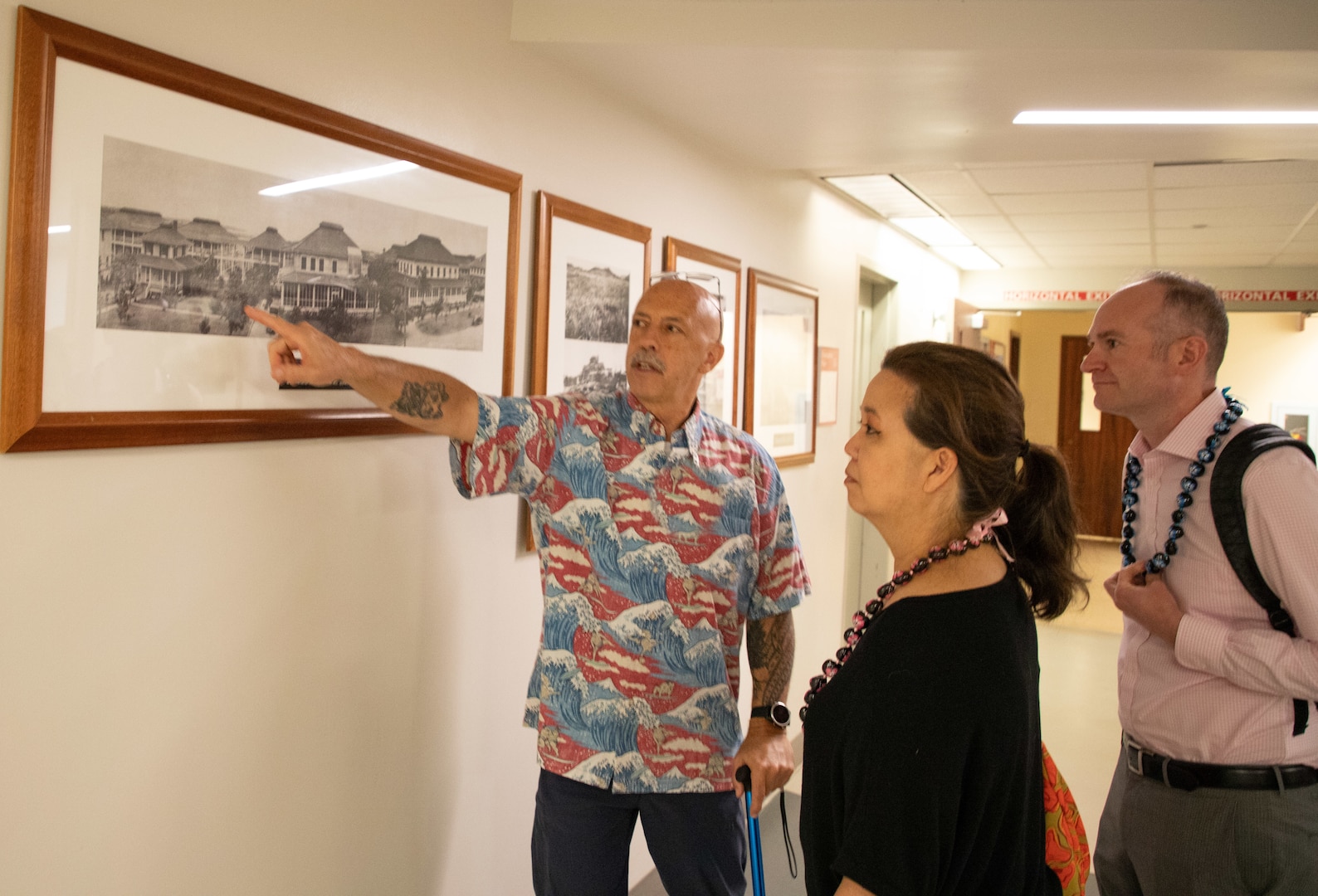 Mr. Joel Jenkins, Tripler Army Medical Center protocol 
officer, provides US. Representative Jill Tokuda and Senior
Policy Advisor Brian Collins a history tour of TAMC on Aug. 21. (Defense Health Agency Photo by Hugh Fleming)