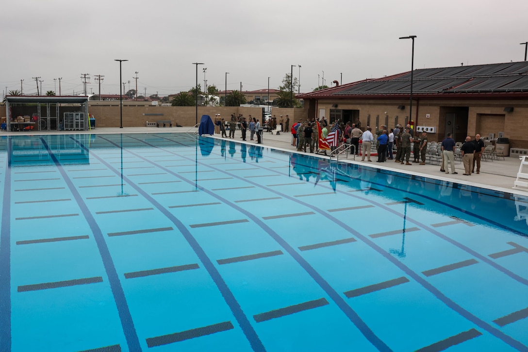 A ribbon-cutting ceremony is held at the 21 Area Combat Water Survival Training Facility at Marine Corps Base Camp Pendleton, California, Aug. 13, 2025. The newly constructed facility will be capable of hosting training events such as Marine Corps swim qualification, Underwater Egress Training, and Submerged Vehicle Egress Training to ensure readiness and maintain amphibious capabilities. (U.S. Marine Corps photo by Cpl. Jacqueline Akamelu)