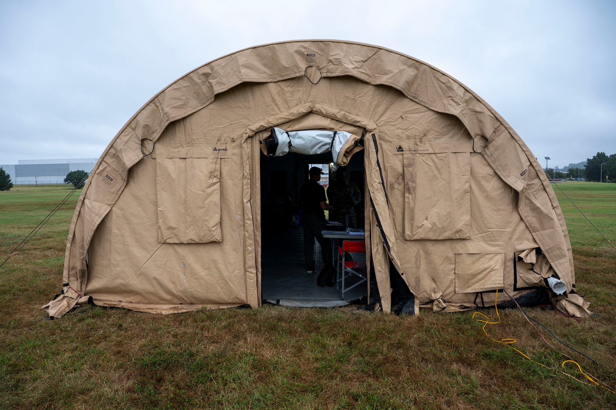 Airmen from the 11th Contracting Squadron work in a tent during a field training exercise at Joint Base Anacostia-Bolling, Washington, D.C., Aug. 19, 2025. The 11th CONS executed annual requirements in an exercise spanning three days that included handwriting contracts and briefing the wing commander. (U.S. Air Force photo by Staff Sgt. Jordan Powell)