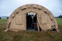 Airmen from the 11th Contracting Squadron work in a tent during a field training exercise at Joint Base Anacostia-Bolling, Washington, D.C., Aug. 19, 2025. The 11th CONS executed annual requirements in an exercise spanning three days that included handwriting contracts and briefing the wing commander. (U.S. Air Force photo by Staff Sgt. Jordan Powell)