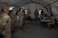 U.S. Airmen with the 11th Contracting Squadron brief U.S. Air Force Col. James M. Clark, commander of Joint Base Anacostia-Bolling and the 11th Wing, Col. Angelique Nelson, 11th Mission Support Group commander, and Lt. Col. Rebecca Ban, 11th Contracting Squadron commander, at JBAB, Washington, D.C. Aug. 19, 2025. The Airmen processed approximately 40 scenarios and received live feedback from both the inspection team and senior leadership to ensure deployment readiness. (U.S. Air Force photo by Staff Sgt. Jordan Powell)