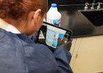 JOINT BASE SAN ANTONIO-FORT SAM HOUSTON - (Aug. 21, 2025) – Hospital Corpsman 3rd Class Nimsi Hernandez, of Lancaster, Calif., assigned to Naval Medical Research Unit (NAMRU) San Antonio, utilizes a computer tablet to search for a Safety Data Sheet (SDS) at the Battlefield Health and Trauma Research Institute. NAMRU San Antonio recently procured a digital SDS database system for use on non-networked computer tablets to replace all physical SDS binders. The Occupational Safety and Health Administration Hazard Communication standard 1910.1200 requires SDSs to be readily accessible during each work shift for all hazardous chemicals in the workplace. NAMRU San Antonio, part of Navy Medicine Research & Development (NMR&D), conducts gap-driven combat casualty care, craniofacial, and directed energy research in support of Navy, Marine Corps and joint U.S. warfighter health readiness and lethality while engaged in routine and expeditionary operations. (U.S. Navy photo by Burrell Parmer, NAMRU San Antonio Public Affairs/Released)