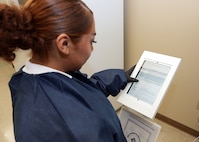 JOINT BASE SAN ANTONIO-FORT SAM HOUSTON - (Aug. 21, 2025) – Hospital Corpsman 3rd Class Nimsi Hernandez, of Lancaster, Calif., assigned to Naval Medical Research Unit (NAMRU) San Antonio, utilizes a digital kiosk to read a Safety Data Sheet (SDS) at the Battlefield Health and Trauma Research Institute. NAMRU San Antonio recently procured a digital SDS database system for use on non-networked computer tablets to replace all physical SDS binders. The Occupational Safety and Health Administration Hazard Communication standard 1910.1200 requires SDSs to be readily accessible during each work shift for all hazardous chemicals in the workplace. NAMRU San Antonio, part of Navy Medicine Research & Development (NMR&D), conducts gap-driven combat casualty care, craniofacial, and directed energy research in support of Navy, Marine Corps and joint U.S. warfighter health readiness and lethality while engaged in routine and expeditionary operations. (U.S. Navy photo by Burrell Parmer, NAMRU San Antonio Public Affairs/Released)