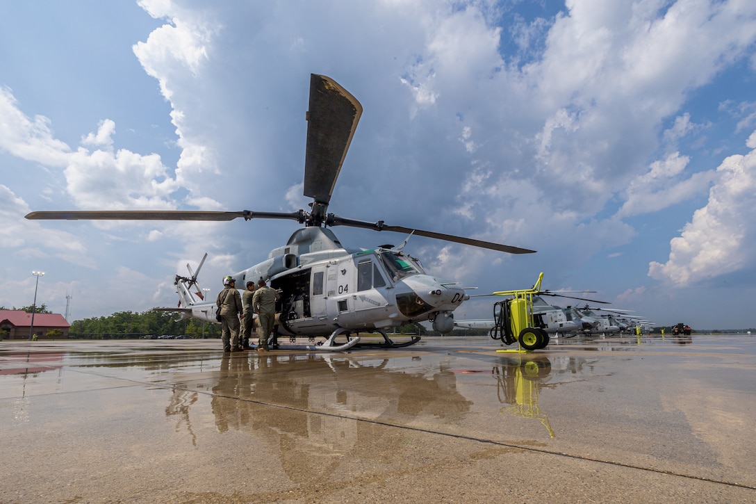 U.S. Marines with Marine Light Attack Helicopter Squadron (HMLA) 775, Marine Aircraft Group 41, 4th Marine Aircraft Wing, prep a UH-1Y Venom utility helicopter to conduct a simulated visit, board, search and seizure operation for Training Exercise Northern Strike at Camp Grayling, Michigan, Aug. 7, 2025. Northern Strike is designed to validate readiness of a Joint Reserve force to cover unique Marine Corps Reserve capabilities and support to active components on a large scale. (U.S. Marine Corps photo by Cpl. Aaron TorresLemus)