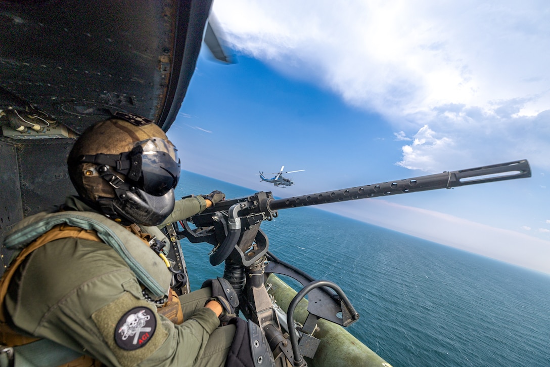 U.S. Marine Corps Sgt. Angel Hernandez, a crew chief with Marine Light Attack Helicopter Squadron (HMLA) 775, Marine Aircraft Group 41, 4th Marine Aircraft Wing, participates in a simulated visit, board, search and seizure operation during Training Exercise Northern Strike at Camp Grayling, Michigan, Aug. 7, 2025. Northern Strike is designed to validate readiness of a Joint Reserve force to cover unique Marine Corps Reserve capabilities and support to active components on a large scale. (U.S. Marine Corps photo by Cpl. Aaron TorresLemus)