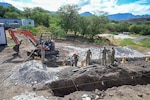 U.S. Airmen assigned to the 165th Airlift Wing, Georgia Air National Guard, and 567th Red Horse Squadron, Seymour Johnson Air Force Base, North Carolina, continue excavating soil for the foundation of a tiny home at Puʻuhonua o Waiʻanae, an affordable housing site, during Innovation Readiness Training (IRT) in Waiʻanae, Hawaii, July 9, 2025.