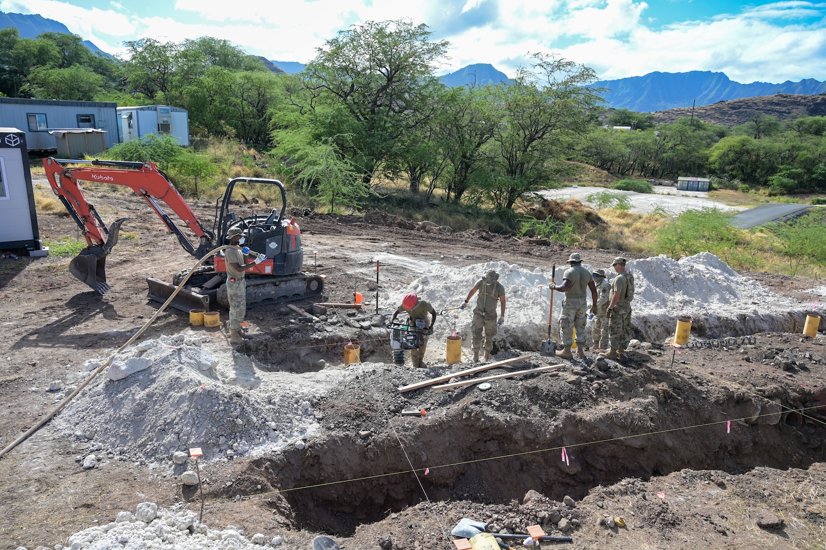U.S. Airmen assigned to the 165th Airlift Wing, Georgia Air National Guard, and 567th Red Horse Squadron, Seymour Johnson Air Force Base, North Carolina, continue excavating soil for the foundation of a tiny home at Puʻuhonua o Waiʻanae, an affordable housing site, during Innovation Readiness Training (IRT) in Waiʻanae, Hawaii, July 9, 2025.