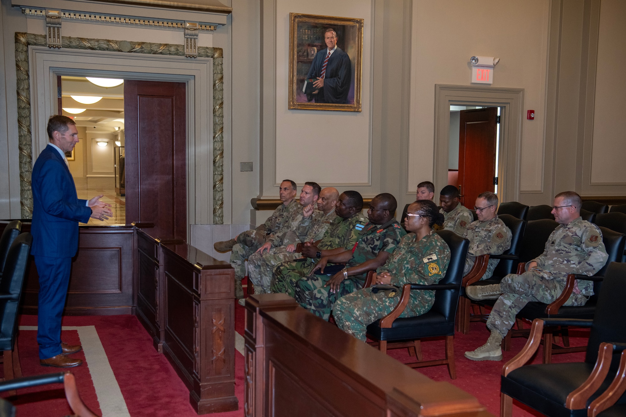 Air National Guard judge advocates and state partnership program attorneys listen to a brief from Judge Jefferson Griffin at the North Carolina Court of Appeals, in Raleigh, North Carolina, July 31, 2025.