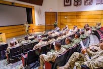 Colombian army Sgt. Maj. Duan Gomez Bustamante, student at the Colombian Armed Forces Sergeants Major Academy and Programa Integral para Suboficiales de Alta Jerarquía (PISAJ) 21 participant, discusses challenges facing the Colombian military with fellow students during the PISAJ 21 culminating event at the U.S. Army Sergeants Major Academy, Fort Bliss, Texas, Aug. 21, 2025. PISAJ is a biannual, partner nation-funded initiative aligned with U.S. Southern Command’s Theater Campaign Plan and directly supports the Colombian army transformation to align its noncommissioned officer corps with globally recognized standards. (U.S. Army photo by Staff Sgt. Joshua Taeckens)
