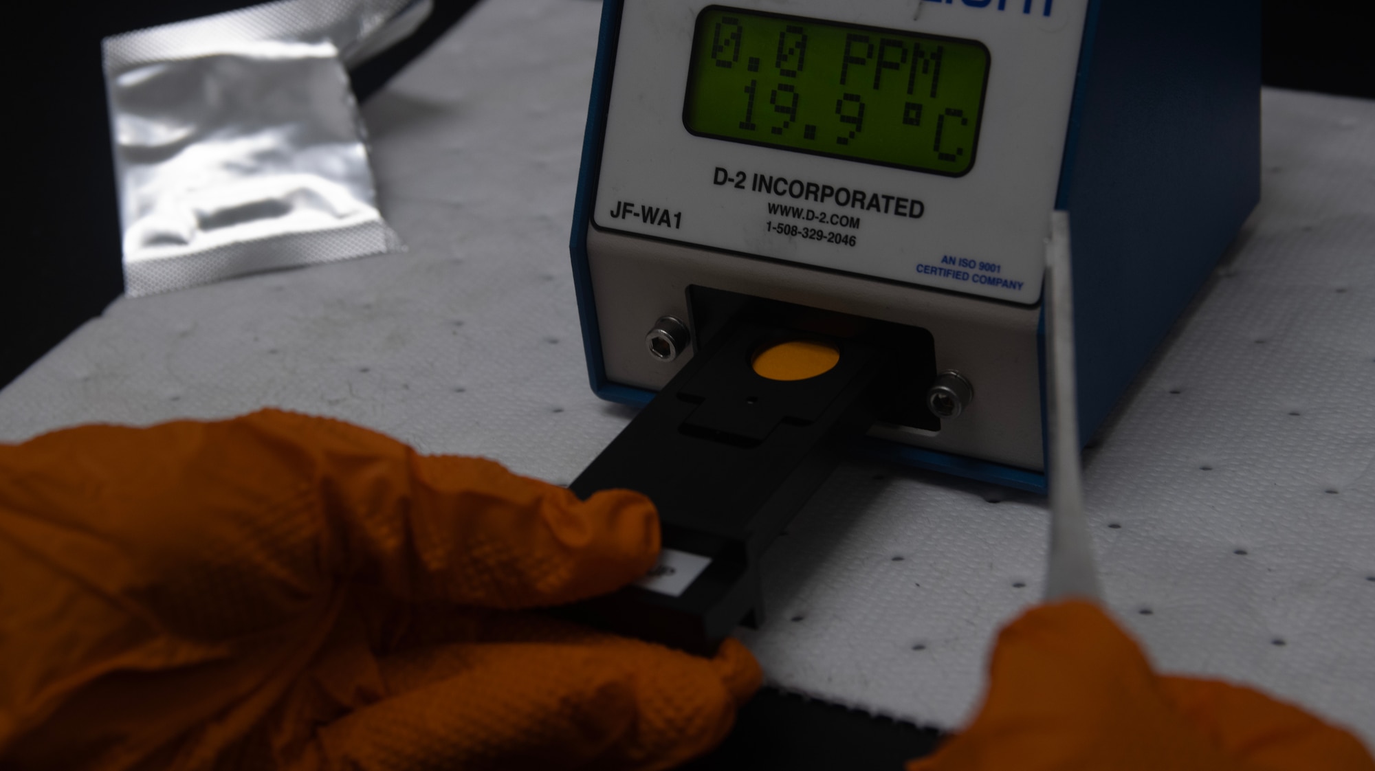 A fuels laboratory technician assigned to the 1st Special Operations Wing tests a free water detector pad at Hurlburt Field, Florida, Aug. 7, 2025.