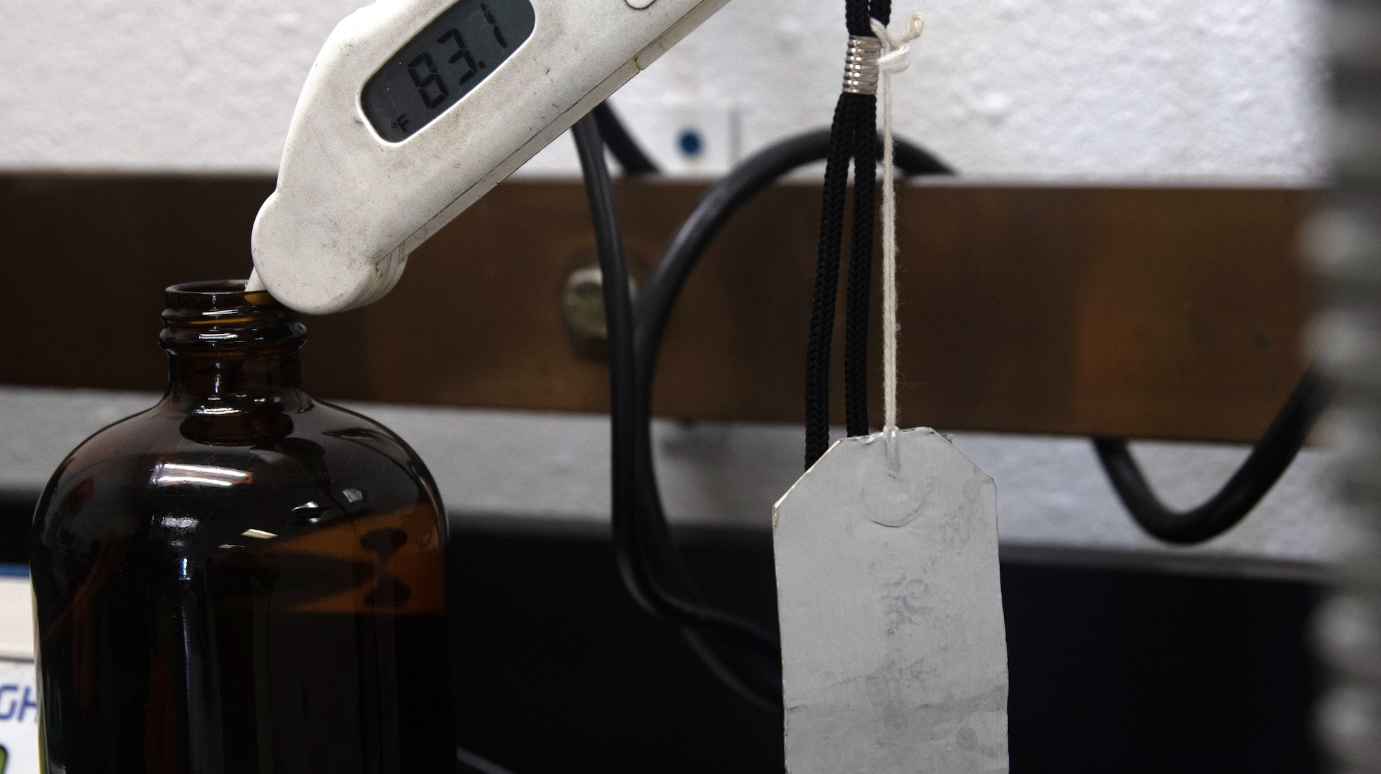 A fuels laboratory technician assigned to the 1st Special Operations Wing tests the fuel’s conductivity by taking its temperature at Hurlburt Field, Florida, Aug. 7, 2025.