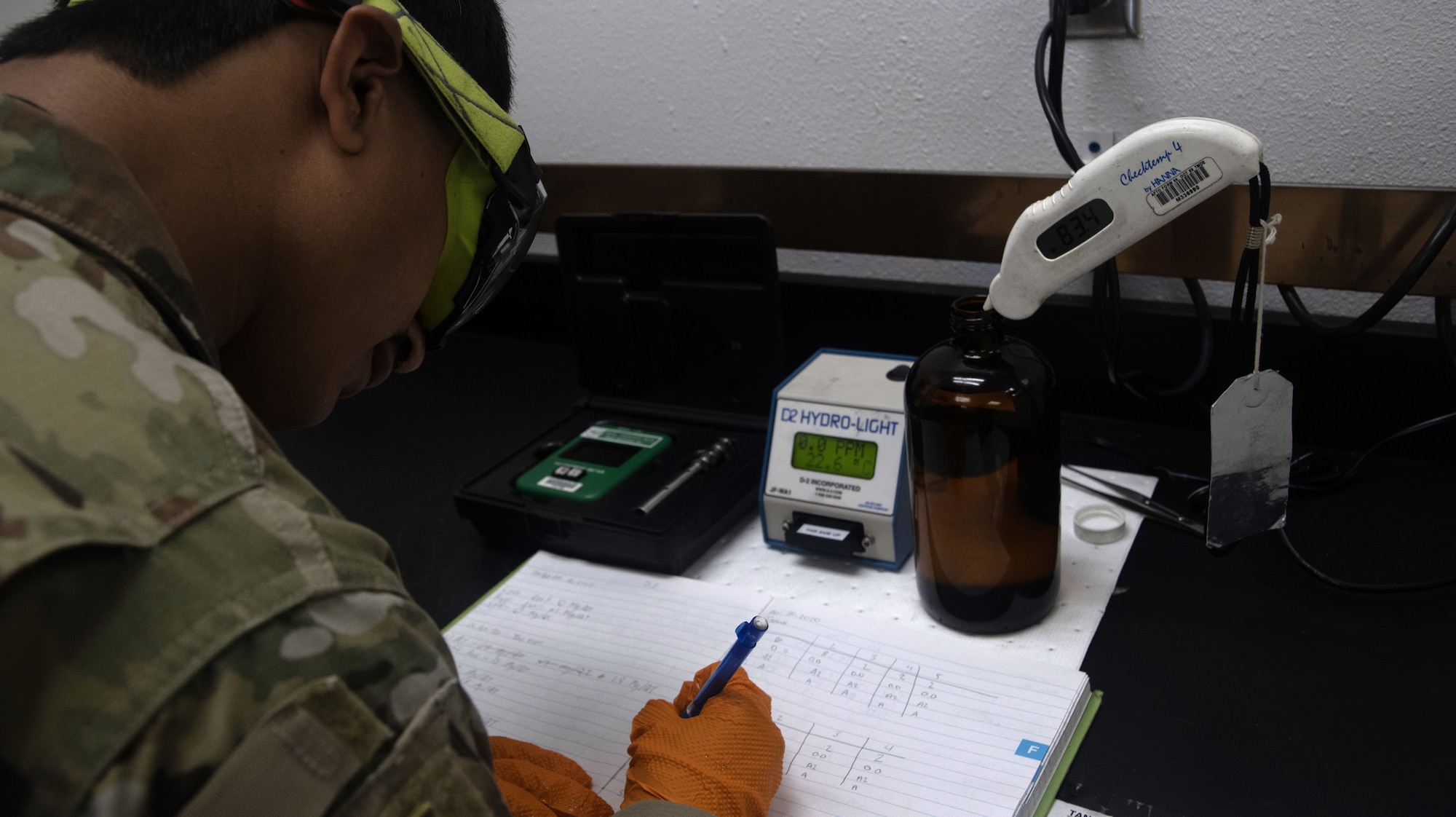 A fuels laboratory technician assigned to the 1st Special Operations Wing logs fuel readings for test samples at Hurlburt Field, Florida, Aug. 7, 2025.