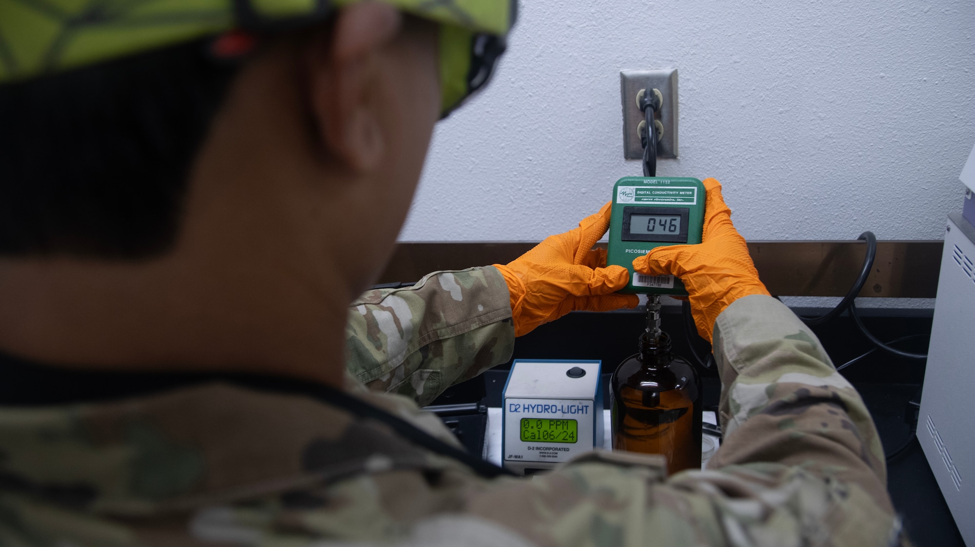 A fuels laboratory technician assigned to the 1st Special Operations Wing uses a digital conductivity meter to test a fuel sample’s temperature and conductivity at Hurlburt Field, Florida, Aug. 7, 2025.