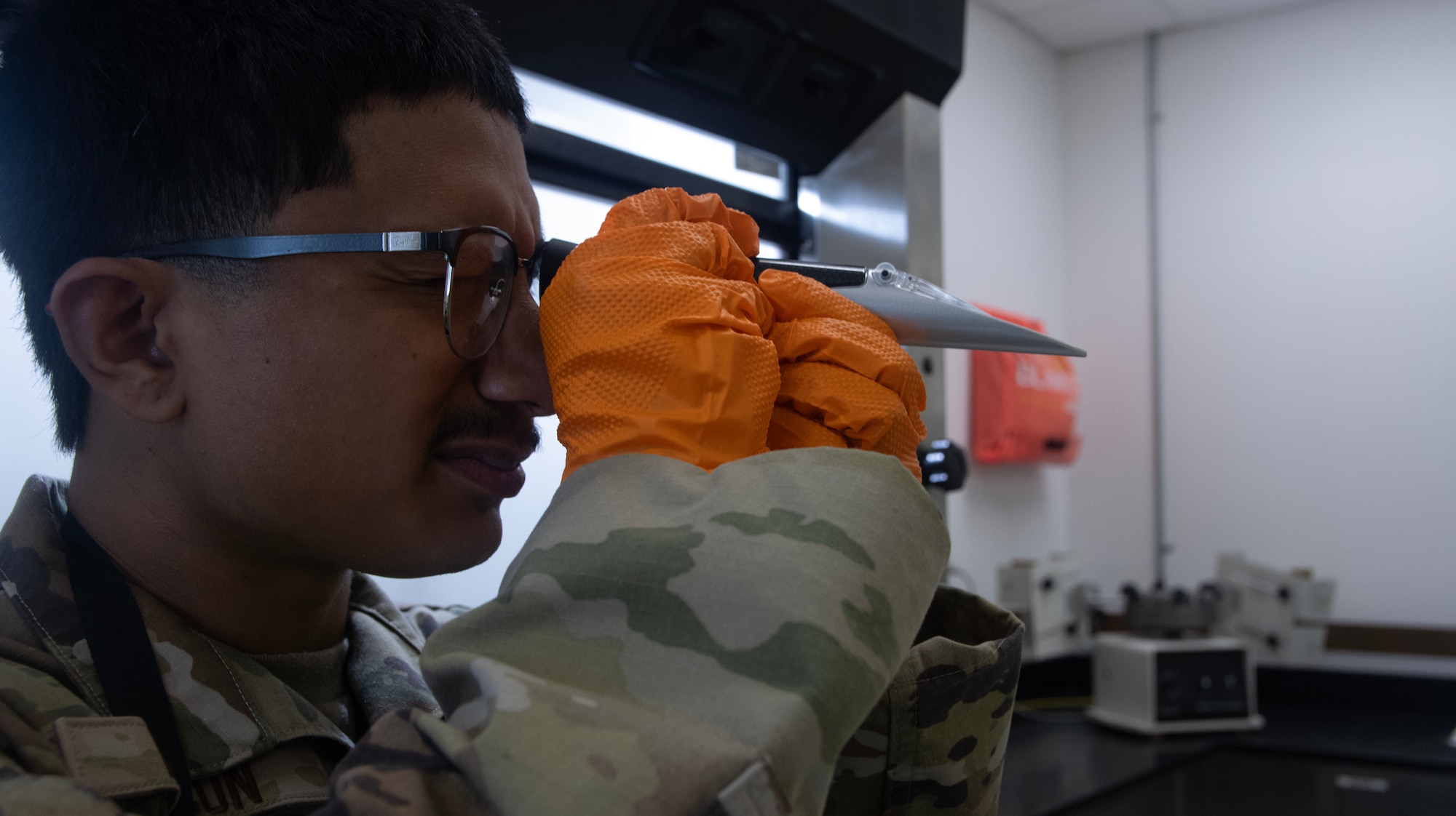 A fuels laboratory technician assigned to the 1st Special Operations Wing examines a fuel sample using the refractometer at Hurlburt Field, Florida, Aug. 7, 2025.