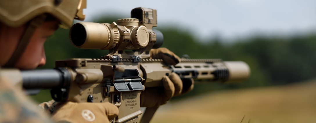 U.S. Marine Corps Sgt. Adam Haswell, an instructor and competitor with the Marine Corps Shooting Team, Weapons Training Battalion-Quantico, shoots a KS-1 rifle from the prone position during the Long Range Rural Contact at Army Training Centre Pirbright, Guildford, England, July 25, 2025. The Royal Marines Operational Shooting Competition brings together U.S. Marines from the MCST and Royal Marine Commandos to compete in dynamic marksmanship events using British-issued weapon systems. (U.S. Marine Corps photo by Cpl. Memphis Pitts)