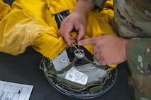 U.S. Air Force Tech. Sgt. Michael Goodwin, 9th Physiological Support Squadron (PSPTS) aircrew flight equipment technician, checks the integrity of one of the full pressure suits used by U-2 Dragon Lady pilots at Beale Air Force Base, California, July 29, 2025.