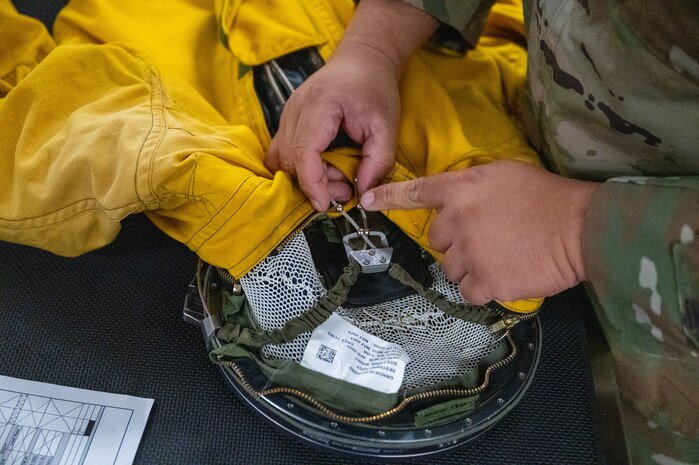 U.S. Air Force Tech. Sgt. Michael Goodwin, 9th Physiological Support Squadron (PSPTS) aircrew flight equipment technician, checks the integrity of one of the full pressure suits used by U-2 Dragon Lady pilots at Beale Air Force Base, California, July 29, 2025.