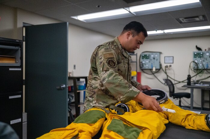 U.S. Air Force Tech. Sgt. Michael Goodwin, 9th Physiological Support Squadron (PSPTS) aircrew flight equipment technician, checks the integrity of one of the full pressure suits used by U-2 Dragon Lady pilots at Beale Air Force Base, California, July 29, 2025.