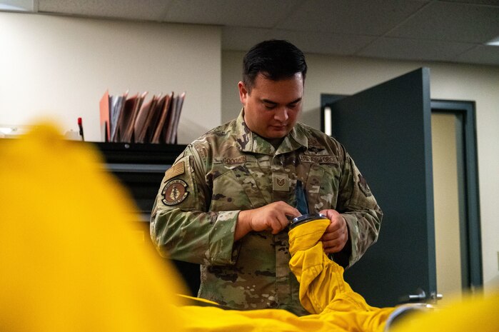 U.S. Air Force Tech. Sgt. Michael Goodwin, 9th Physiological Support Squadron (PSPTS) aircrew flight equipment technician, checks the integrity of one of the full pressure suits used by U-2 Dragon Lady pilots at Beale Air Force Base, California, July 29, 2025