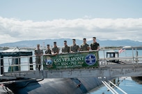 Capt. Chris Hedrick, commander, Submarine Squadron 1, left, Col. Gabriel L. Diana, 3rd Marine Littoral Regiment commanding officer, second from left, and staff pose for a photo on the brow before a tour of the Virginia-class fast-attack submarine USS Vermont (SSN 792) on Joint Base Pearl Harbor-Hickam, Aug. 14, 2025.