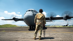 U.S. Air Force Capt. Mary Claire Coleman, 18th Aeromedical Evacuation Squadron flight nurse, treats a simulated patient during a mass casualty training event in the Indo-Pacific region, July 22, 2025. The training supports interoperability and medical readiness goals by preparing crews for future missions and operational challenges in the Indo-Pacific