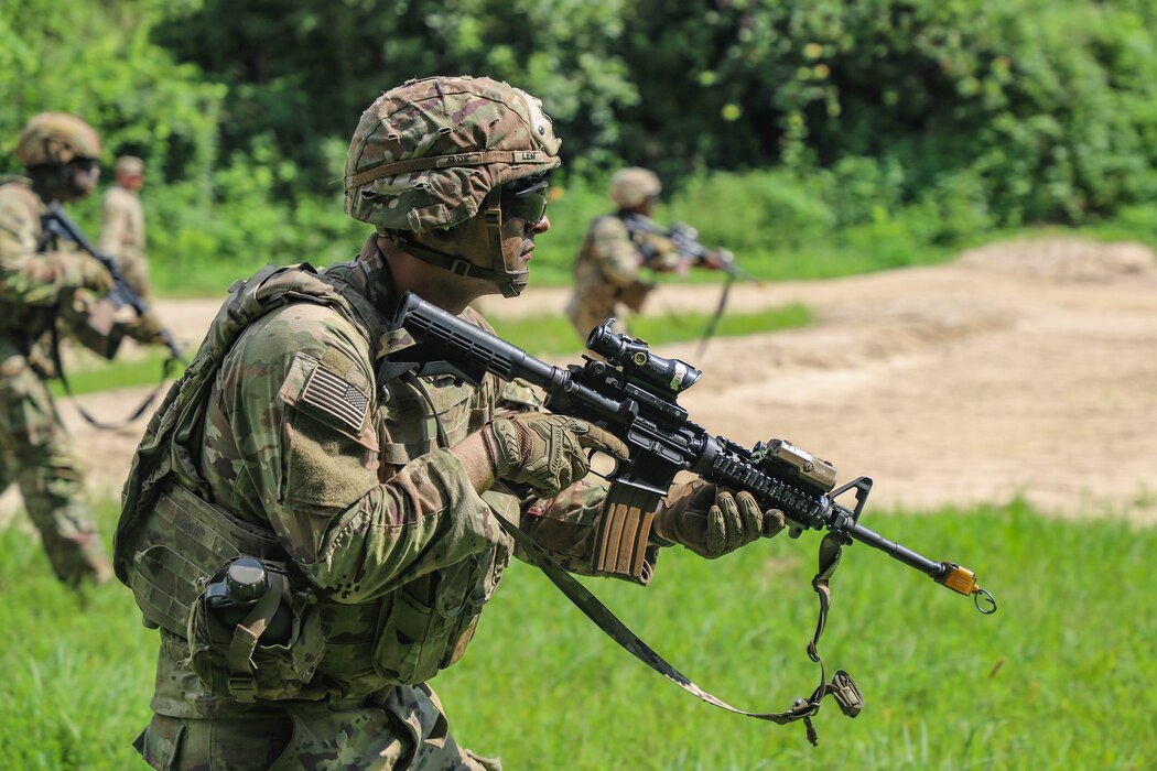 U.S. Army Pvt. Luke Lem, a combat engineer assigned to 55th Combat Engineer Company - Armored, 11th Engineer Battalion, 2d Infantry Division Sustainment Brigade, 2d Infantry Division/ROK-U.S. Combined Division, advances toward objective during a live fire exercise as part of Ulchi Freedom Shield at the Cherokee Range in South Korea, Aug. 22, 2025.