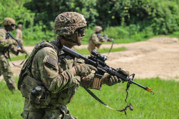 U.S. Army Pvt. Luke Lem, a combat engineer assigned to 55th Combat Engineer Company - Armored, 11th Engineer Battalion, 2d Infantry Division Sustainment Brigade, 2d Infantry Division/ROK-U.S. Combined Division, advances toward objective during a live fire exercise as part of Ulchi Freedom Shield at the Cherokee Range in South Korea, Aug. 22, 2025.